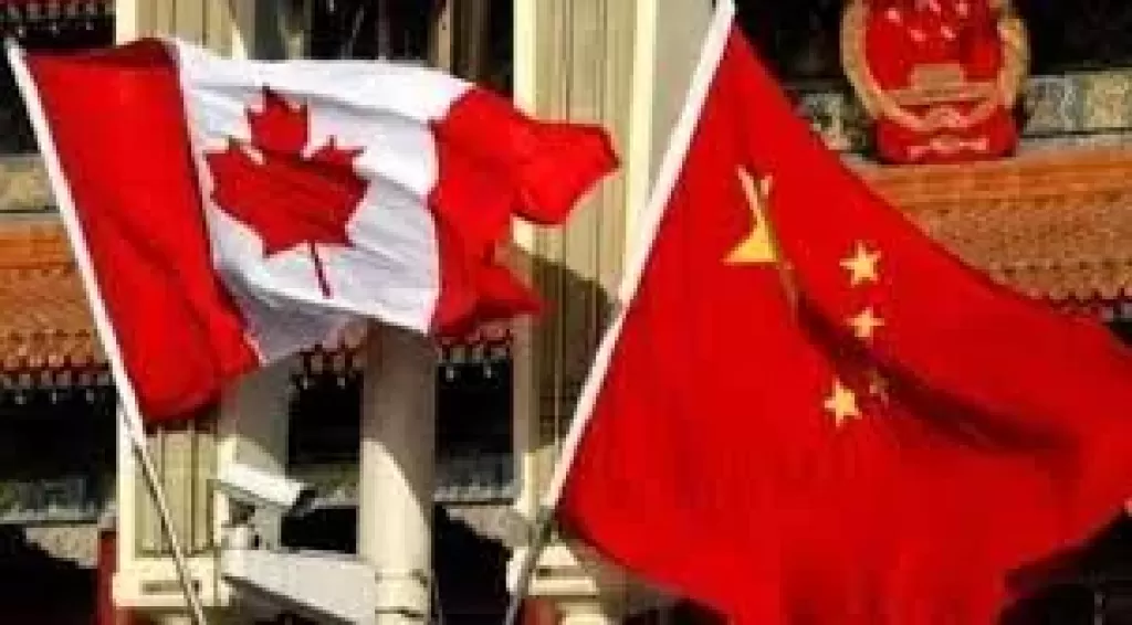 وزيرا خارجية الصين وكندا يبحثان إصلاح العلاقات بين البلدين